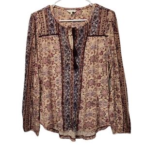 A woman's lucky brand medium.Long sleeve tie neck v key.Cut out  blouse